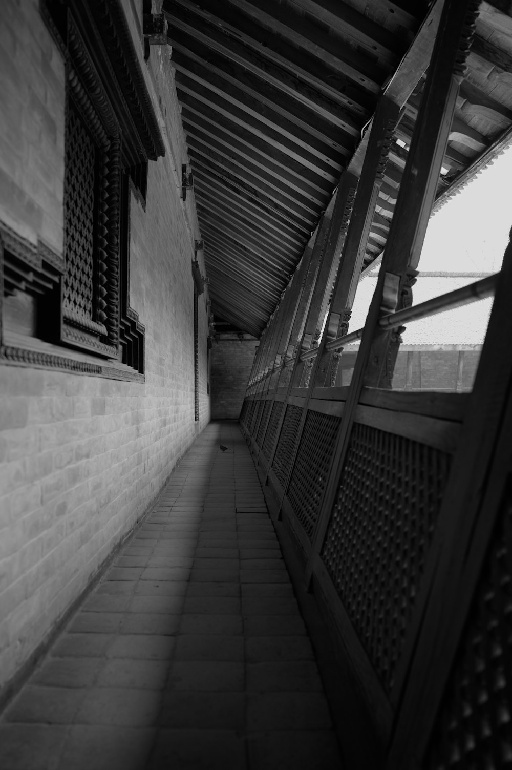 a black and white photo of a walkway