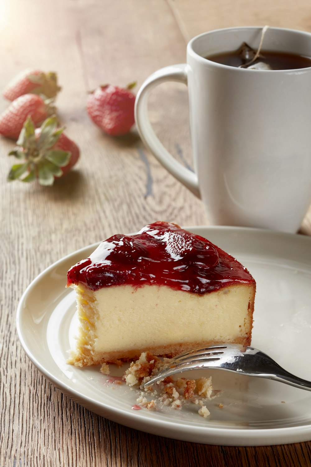 a piece of cheesecake on a plate with a fork