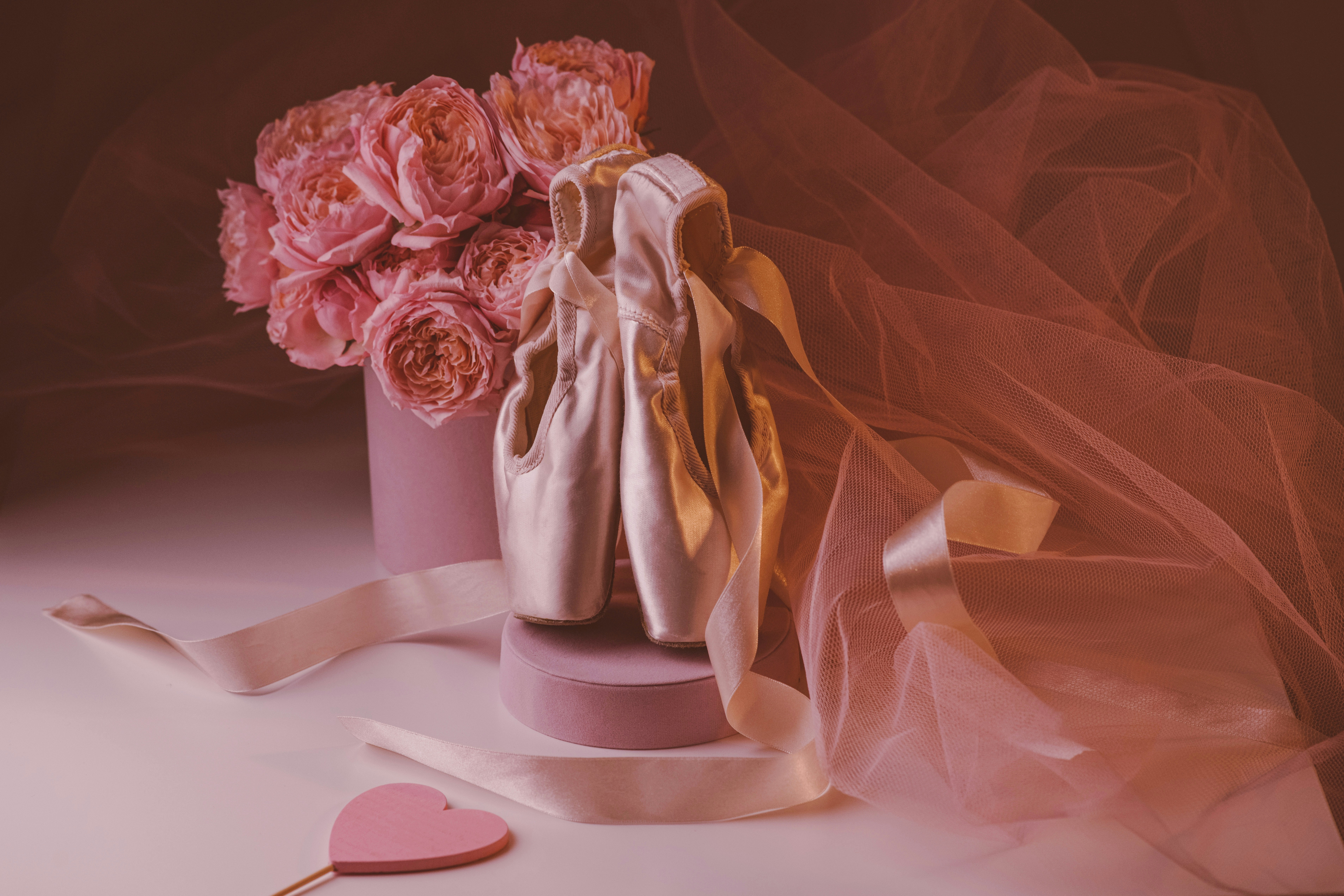 Pink vase with flowers and heart