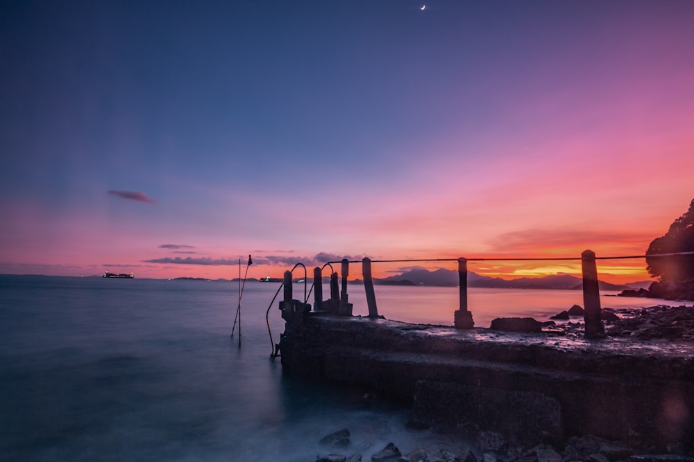 a pier that is next to a body of water