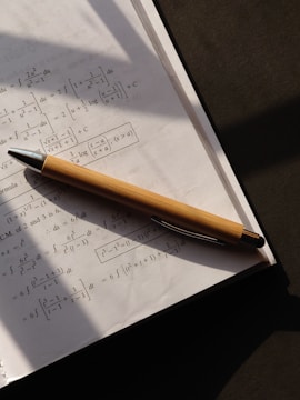 a pen sitting on top of a piece of paper