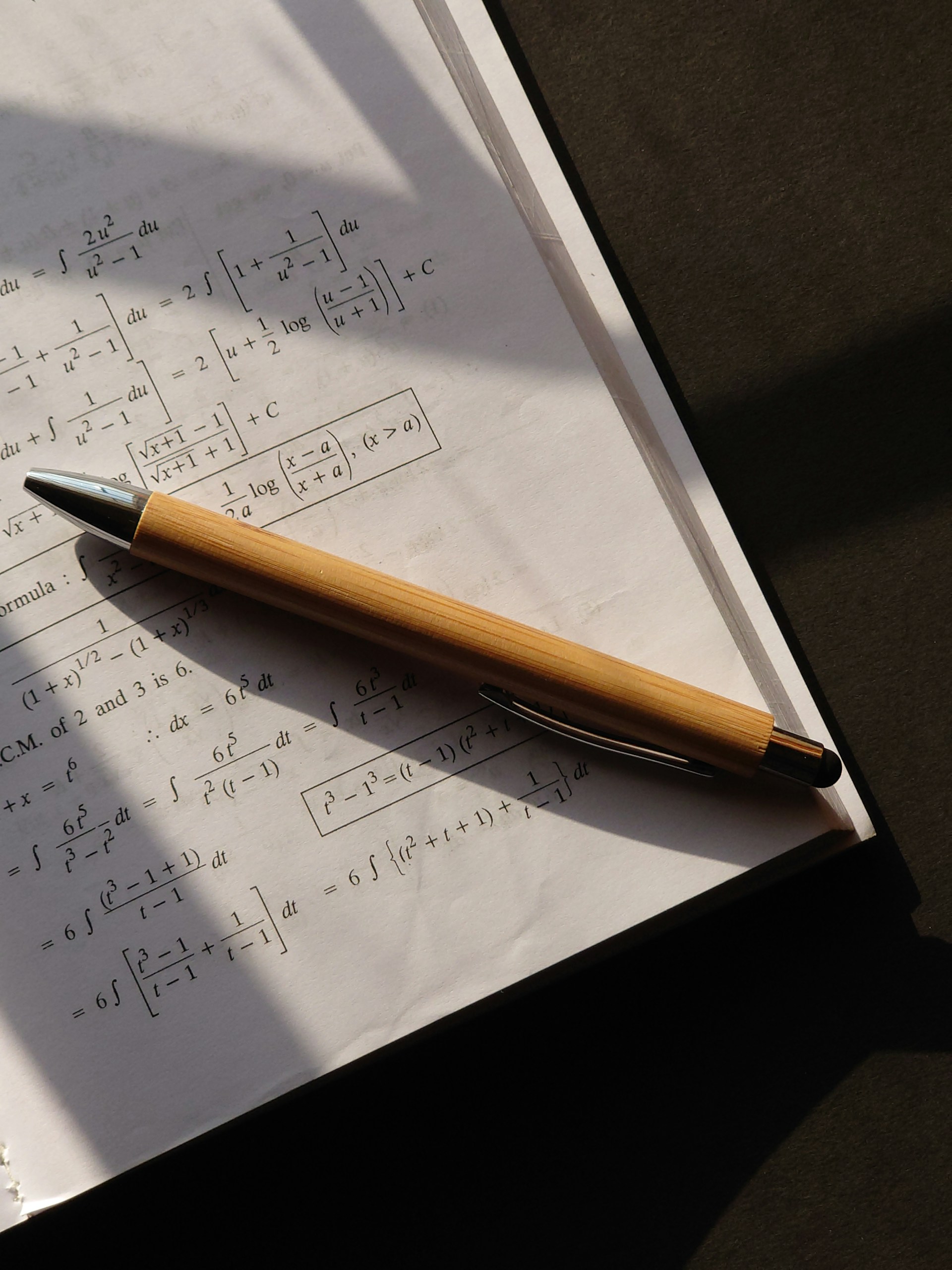 a pen sitting on top of a piece of paper