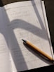 a pen sitting on top of a piece of paper