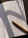 a pen sitting on top of a piece of paper