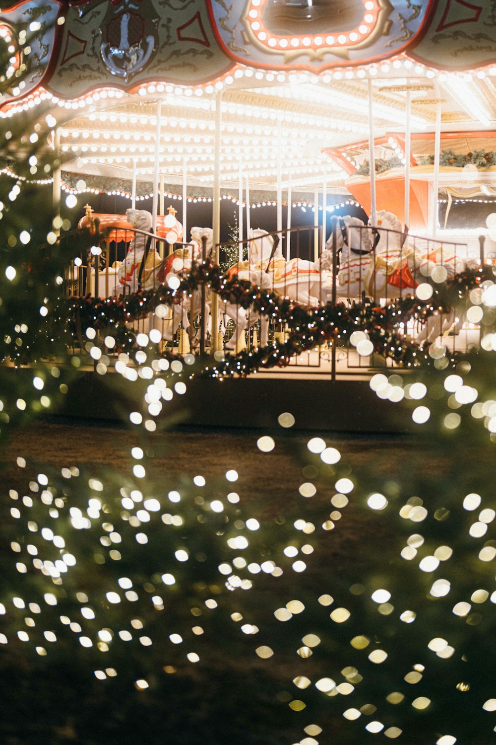 a merry go round with lights on it