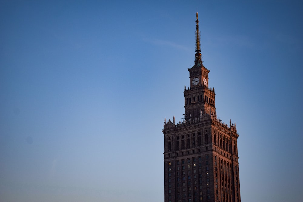 a tall building with a clock on the top of it