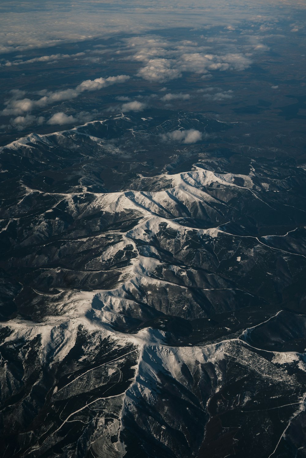 a view of a mountain range from an airplane