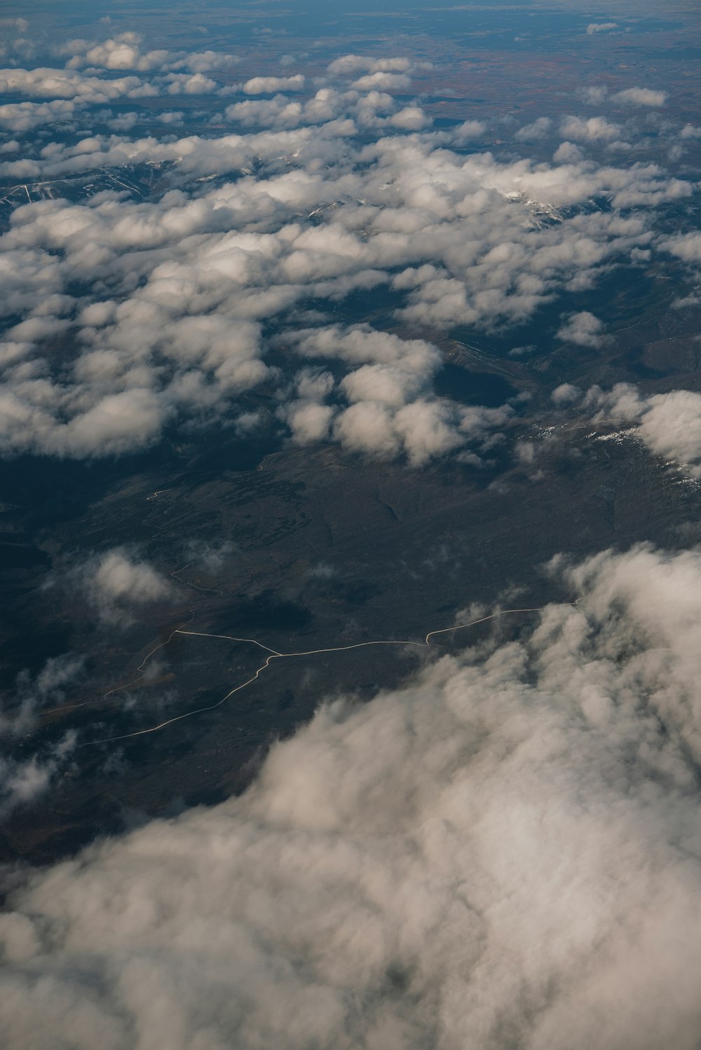 a view of the clouds from an airplane window