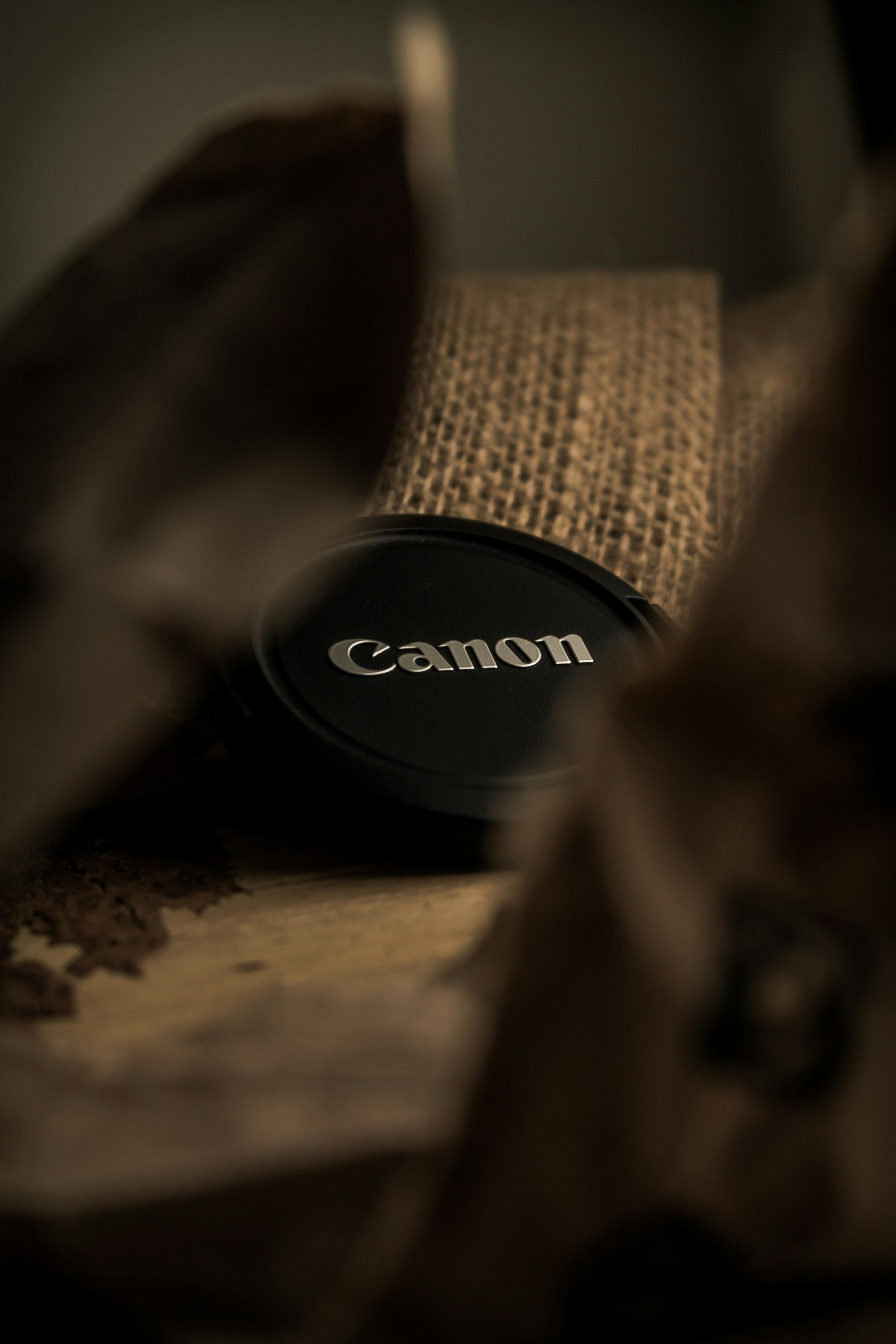 a camera lens sitting on top of a bag