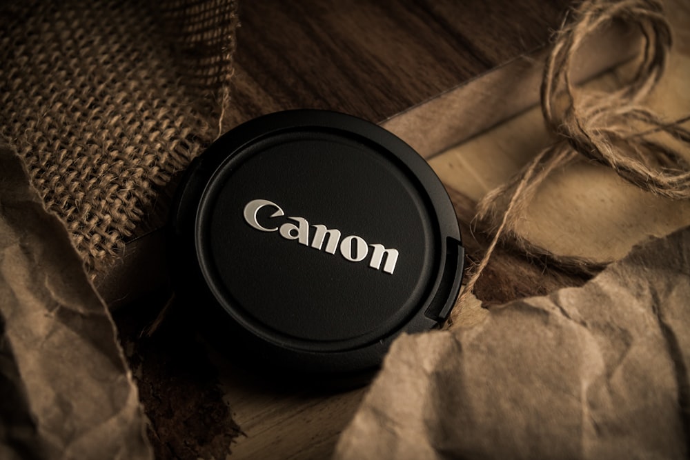 a camera lens cap sitting on top of a piece of paper