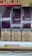 Several packs of Davidoff Magenta Superslims cigarettes are displayed on a shelf. Prominently, there are warning labels stating 'Smoking is highly addictive, don’t start.' The price tag below shows €39.00 for a carton and €3.90 per pack. At the top, part of another sign is partially visible.