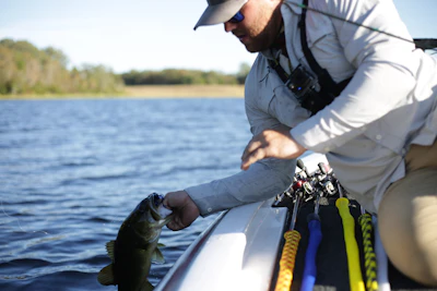Angler holding a bass caught on a Japanese lake