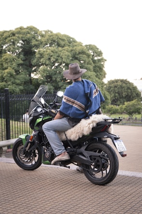 a man riding on the back of a motorcycle