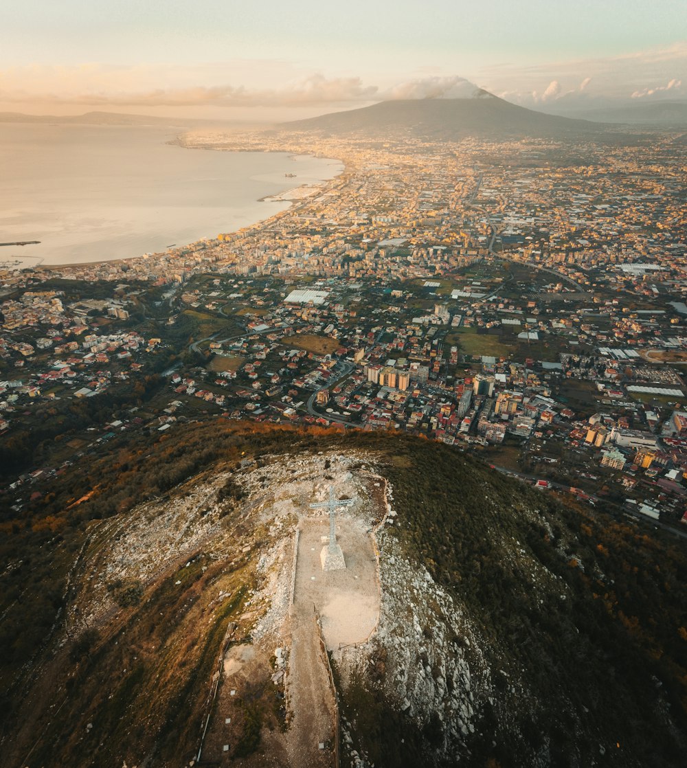 an aerial view of a city and a body of water