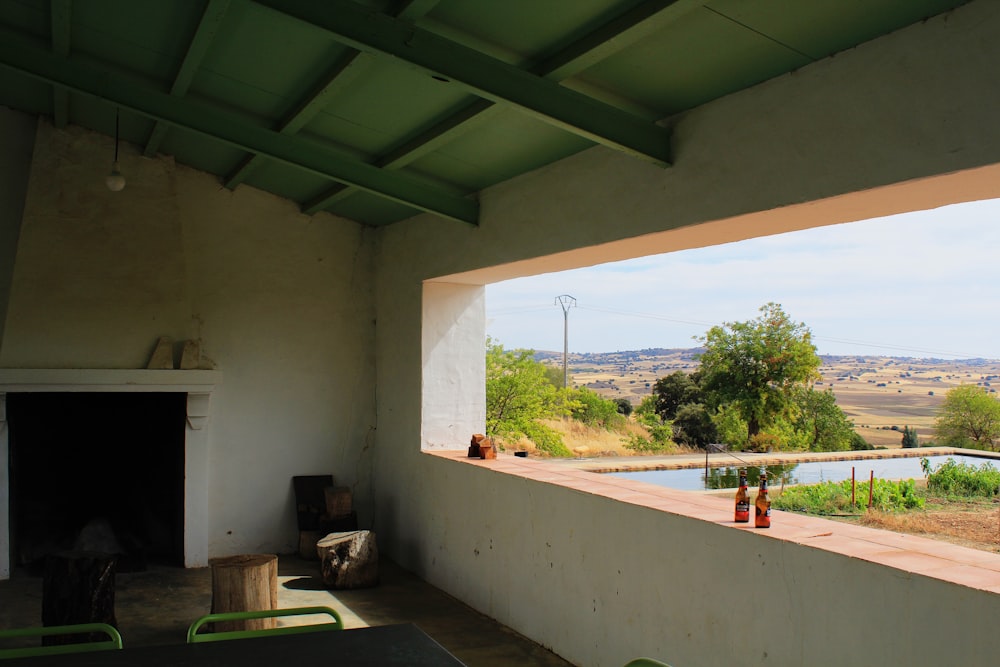 a room with a view of a lake and mountains