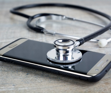 a smart phone with a stethoscope on top of it