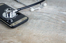 a phone with a stethoscope on top of it
