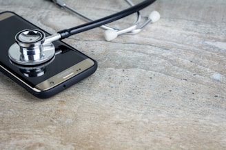 a phone with a stethoscope on top of it