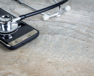 a phone with a stethoscope on top of it