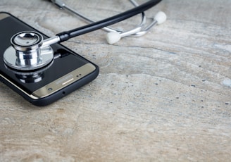 a phone with a stethoscope on top of it