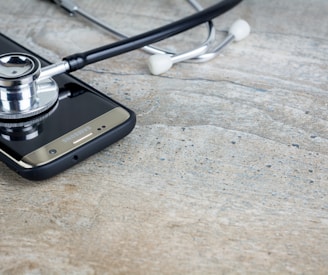 a phone with a stethoscope on top of it
