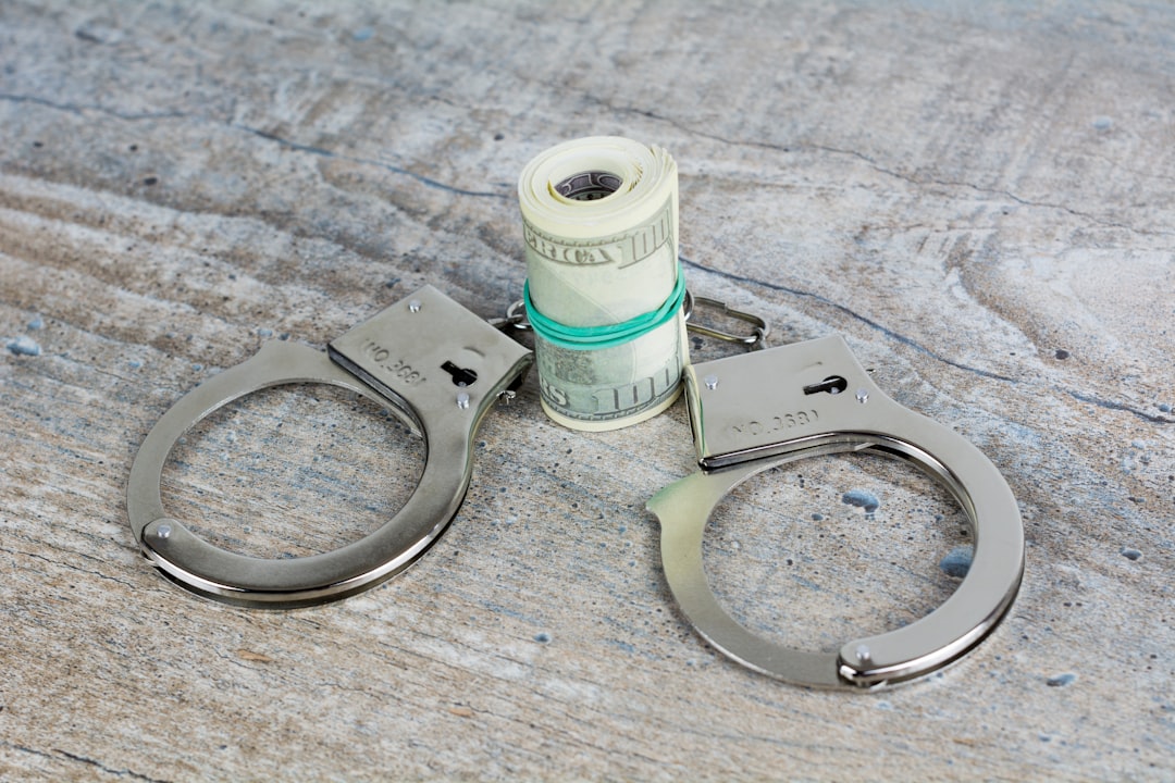 Handcuffs with a roll of money