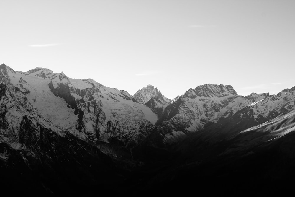 a black and white photo of a mountain range