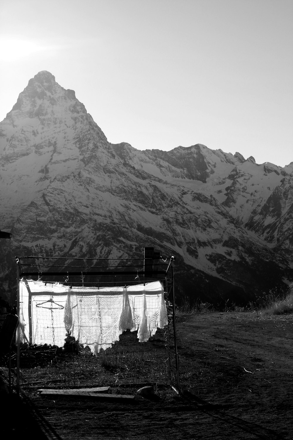 a black and white photo of a snow covered mountain