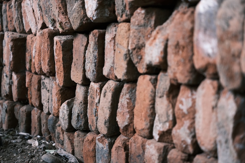 a large pile of red bricks sitting next to each other