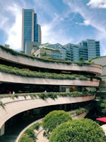 A vibrant urban development project with green spaces.