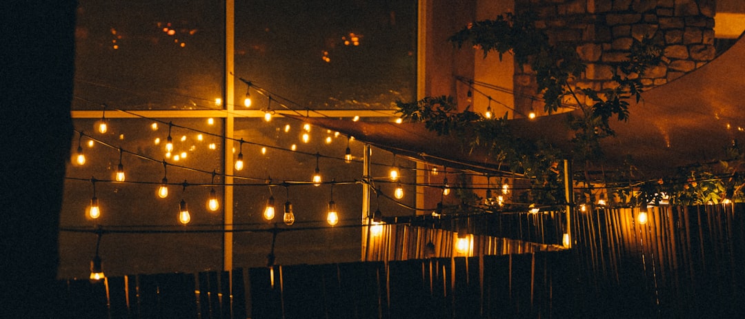 a room filled with lots of lights next to a window, Fairy Lights Italian Restaurant