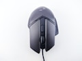 A wired computer mouse with a sleek, ergonomic design and matte black finish. It features a scroll wheel and additional buttons on the top, suitable for gaming or professional use.