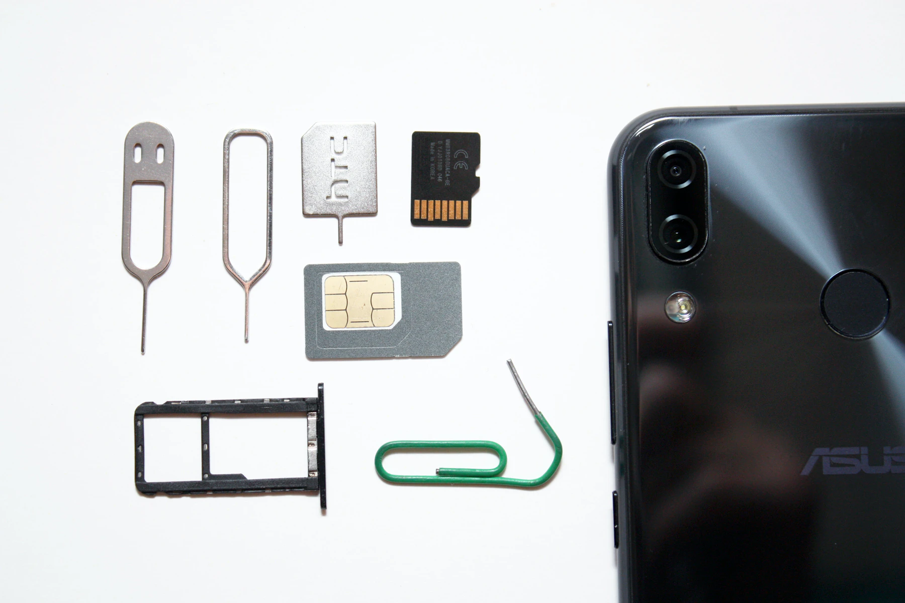Smartphone beside a SIM card for mobile connectivity planning