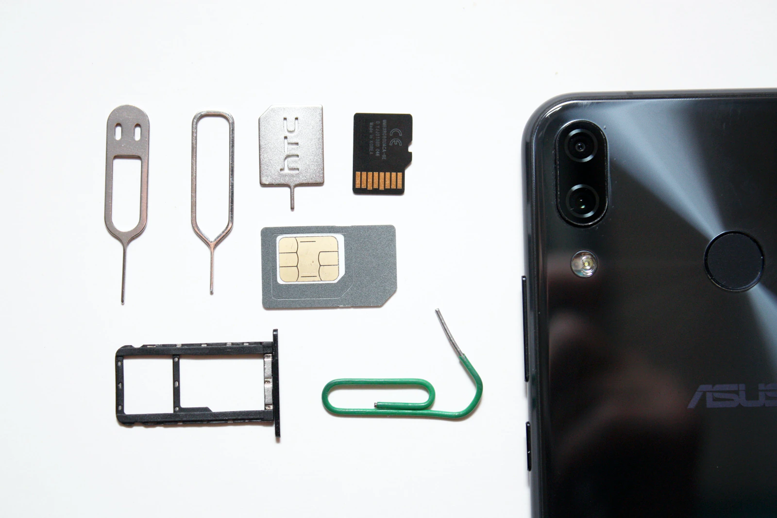 Smartphone with SIM card and SIM tray tools