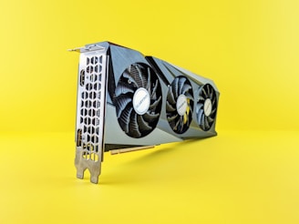 a close up of a computer fan on a yellow background
