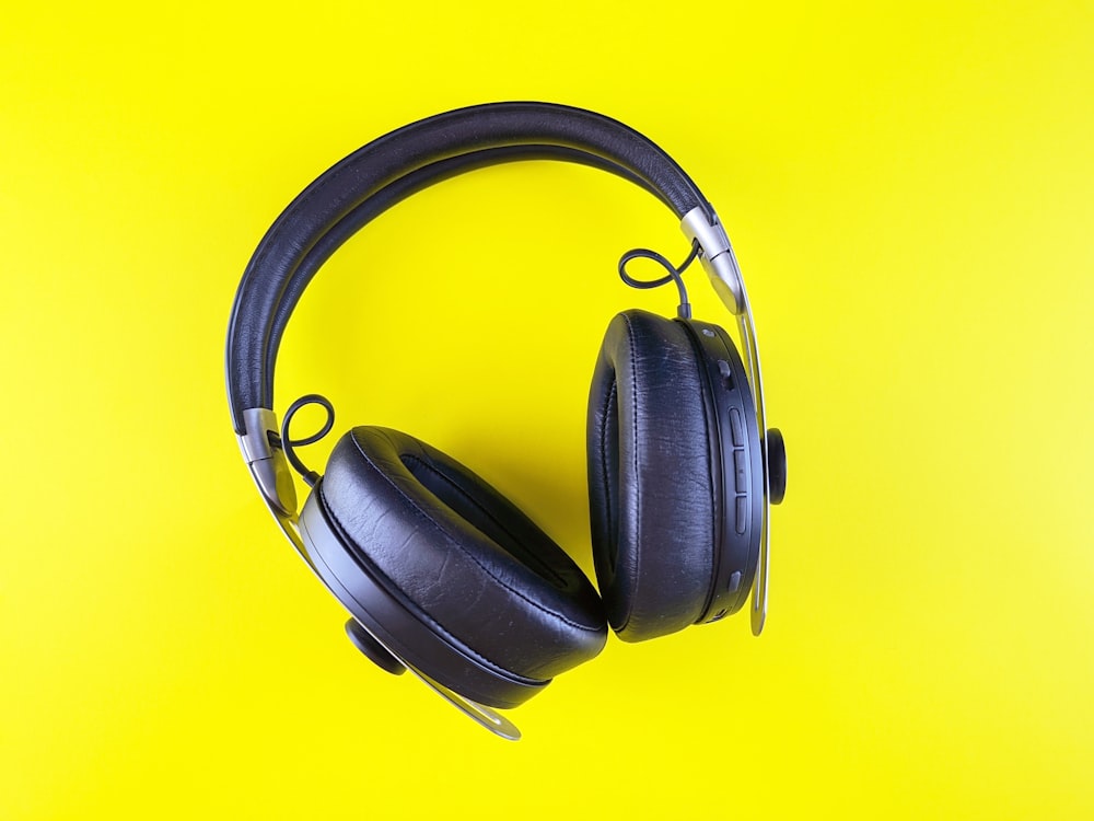 a pair of headphones on a yellow background