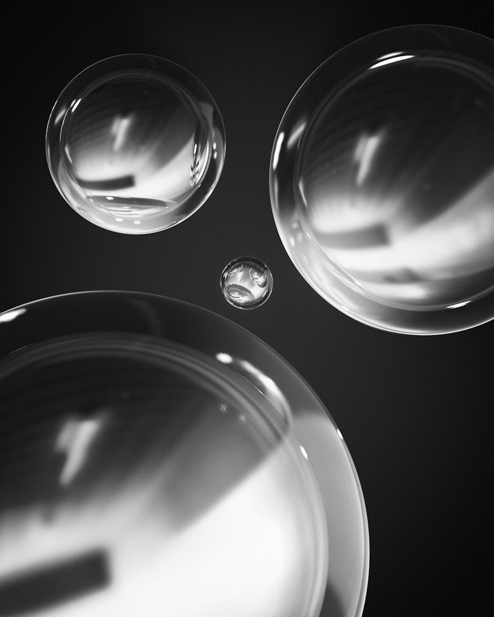 a black and white photo of three bubbles