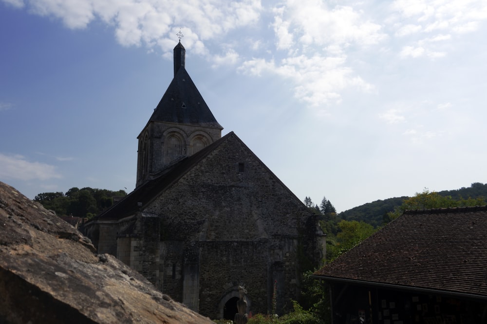 an old building with a steeple and a steeple on top