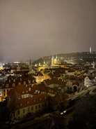 Night view of a European city skyline illuminated with energy-efficient lighting.