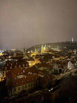 Night view of a European city skyline illuminated with energy-efficient lighting.