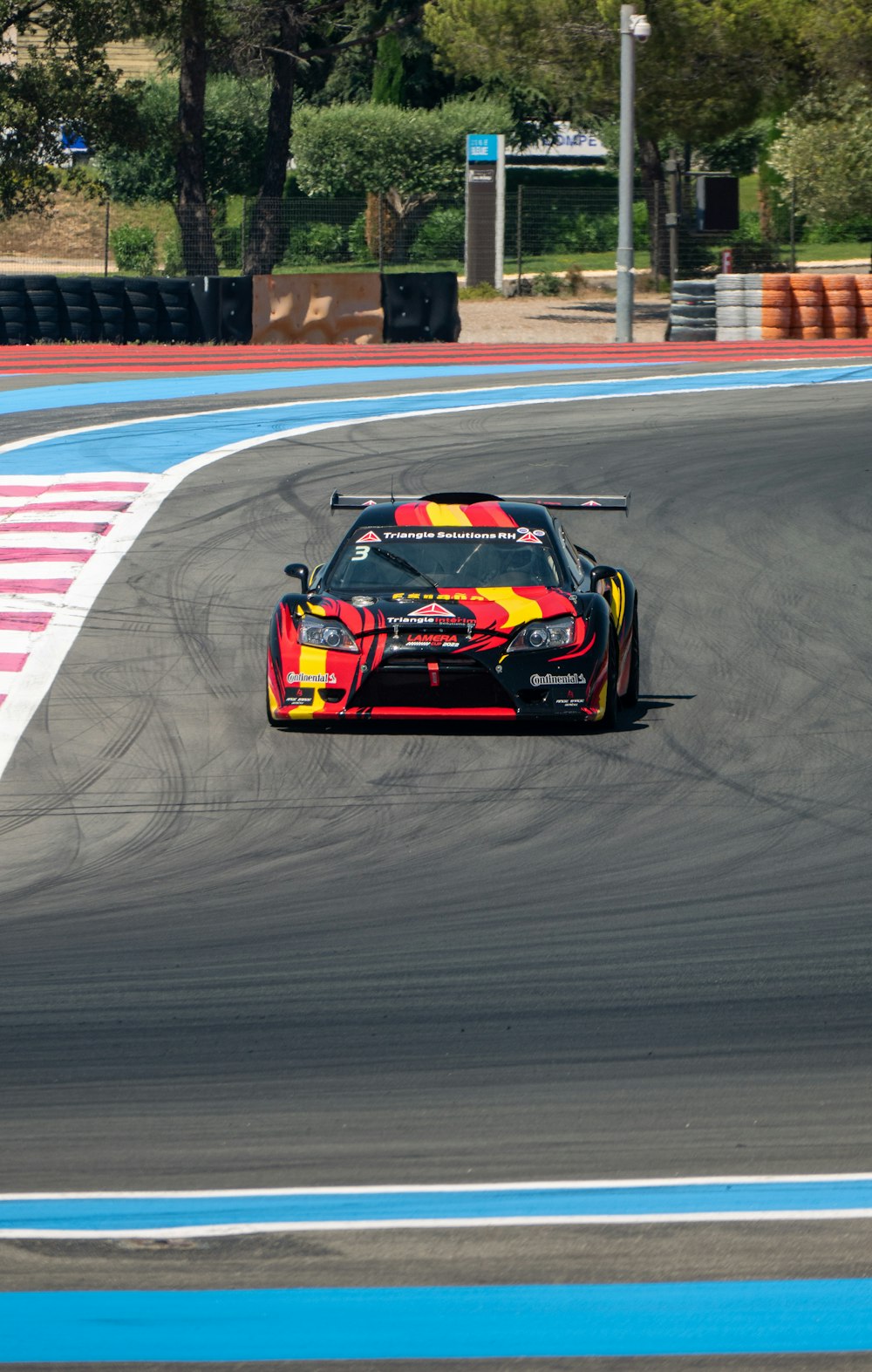 a racing car driving on a race track