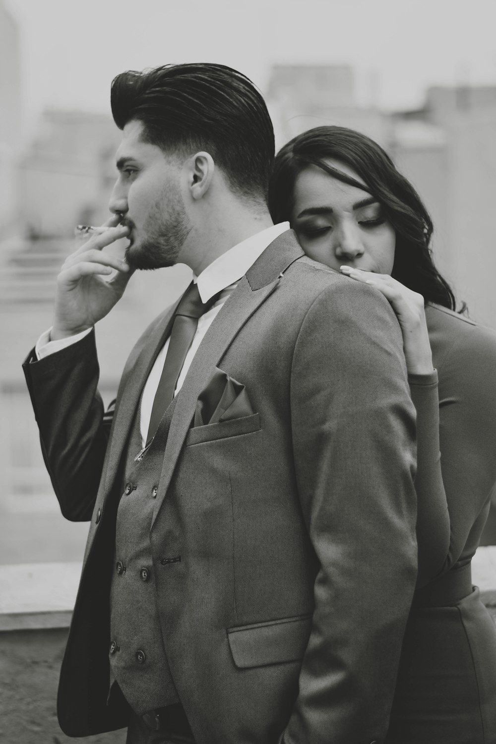 a man and a woman standing next to each other