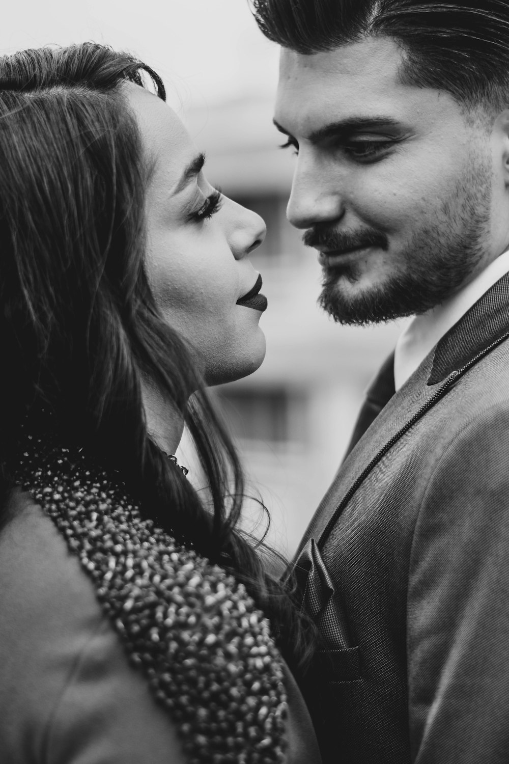 a black and white photo of a man and a woman