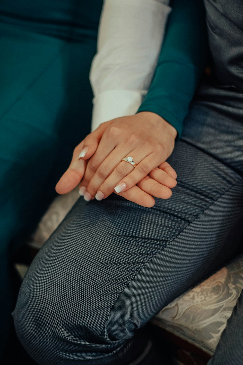 a close up of a person sitting on a chair