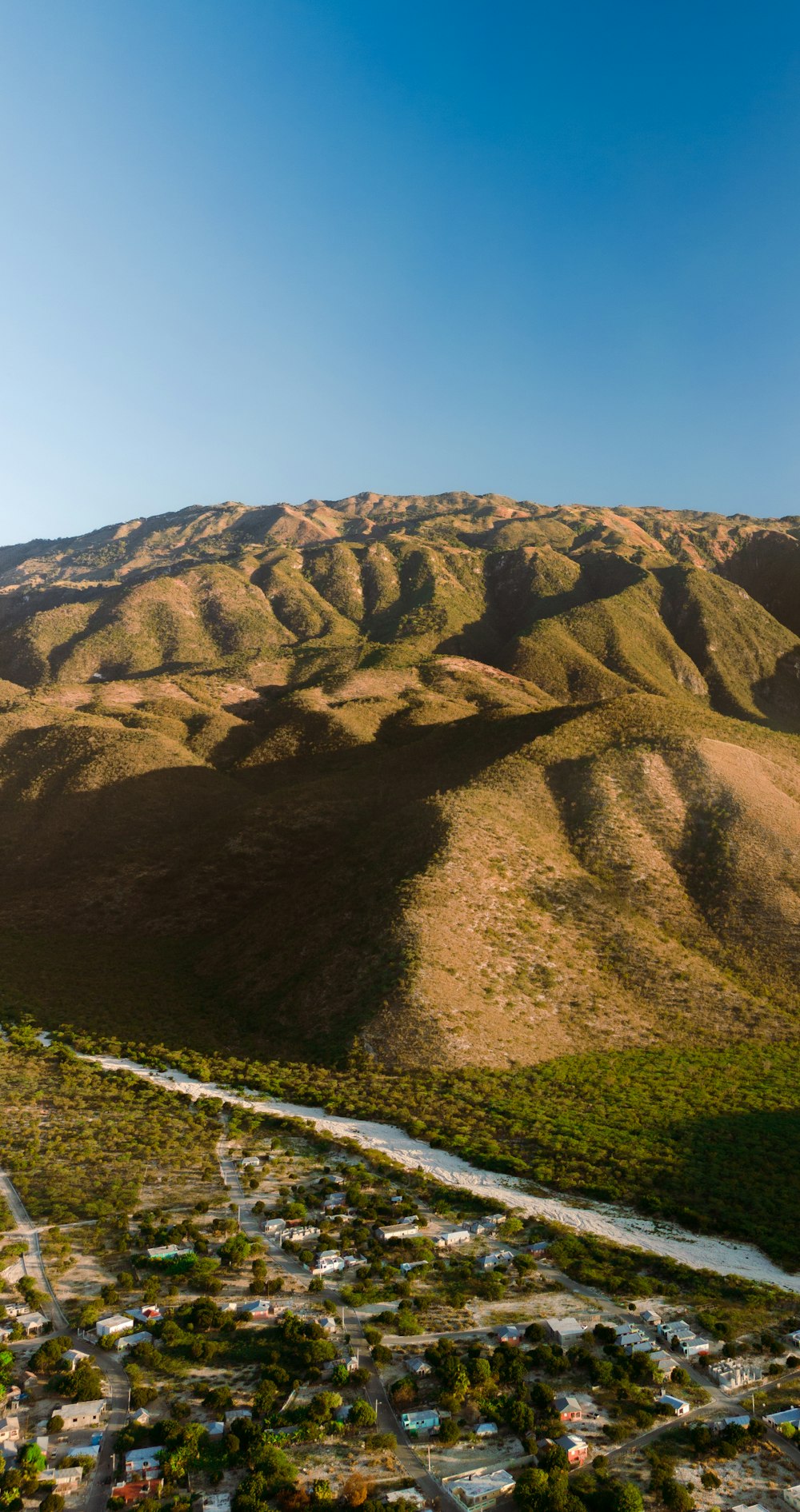 an aerial view of a small town in the mountains