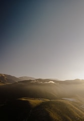 A serene landscape with soft clouds filtering sunlight over a clean, fresh environment.