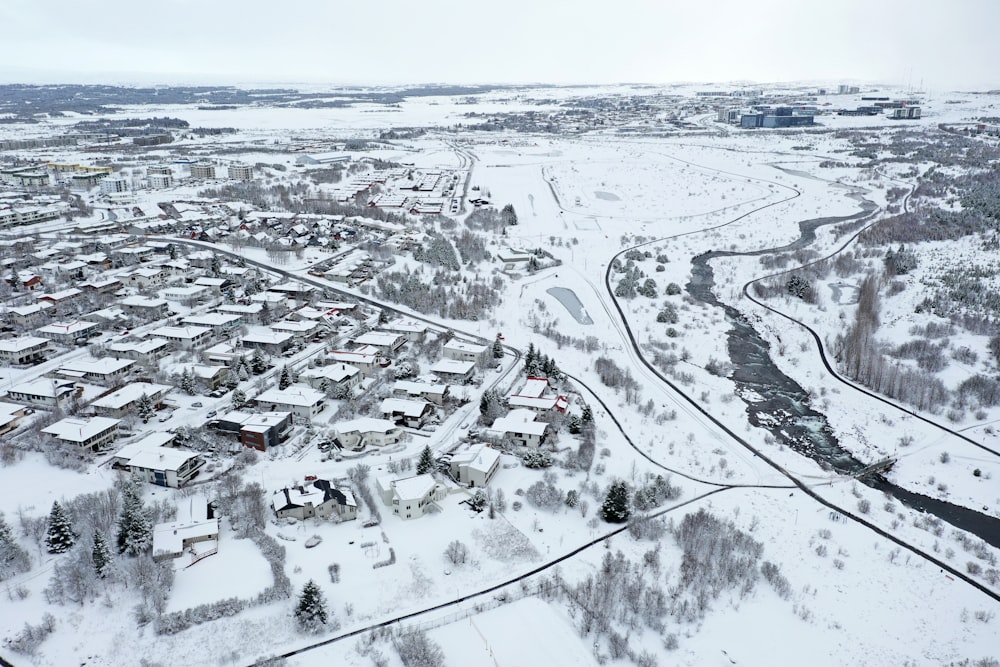 an aerial view of a snow covered town