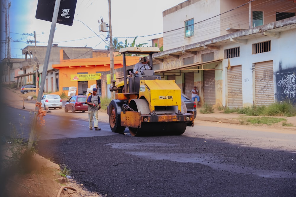 a street sweeper on the side of the road