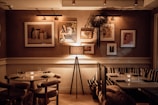 A cozy dining area with intimate lighting and table settings.