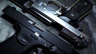 a close up of a gun and a knife
